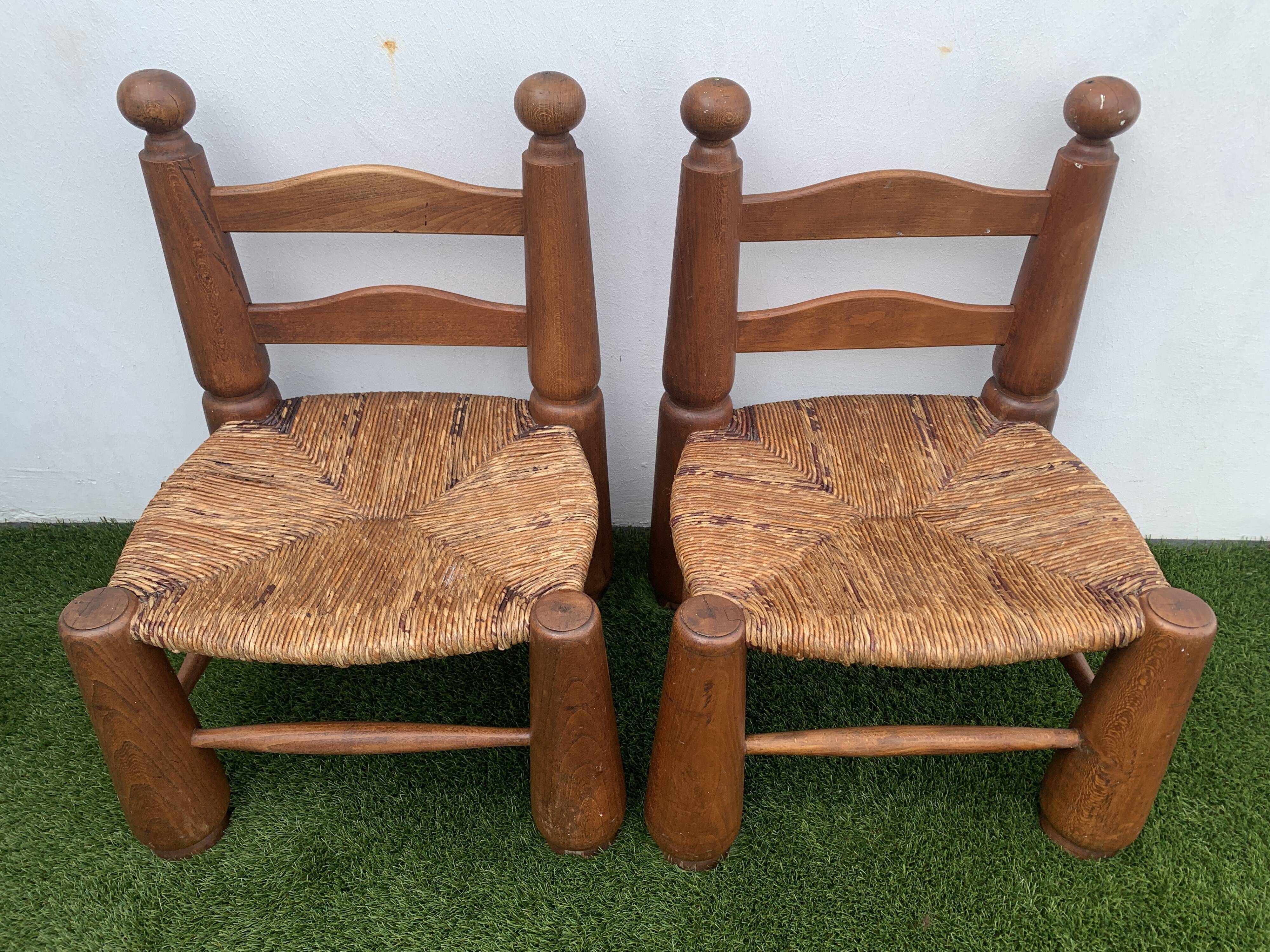 Pair of antique low fire chairs made of wood and straw
