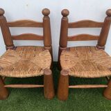 Pair of antique low fire chairs made of wood and straw