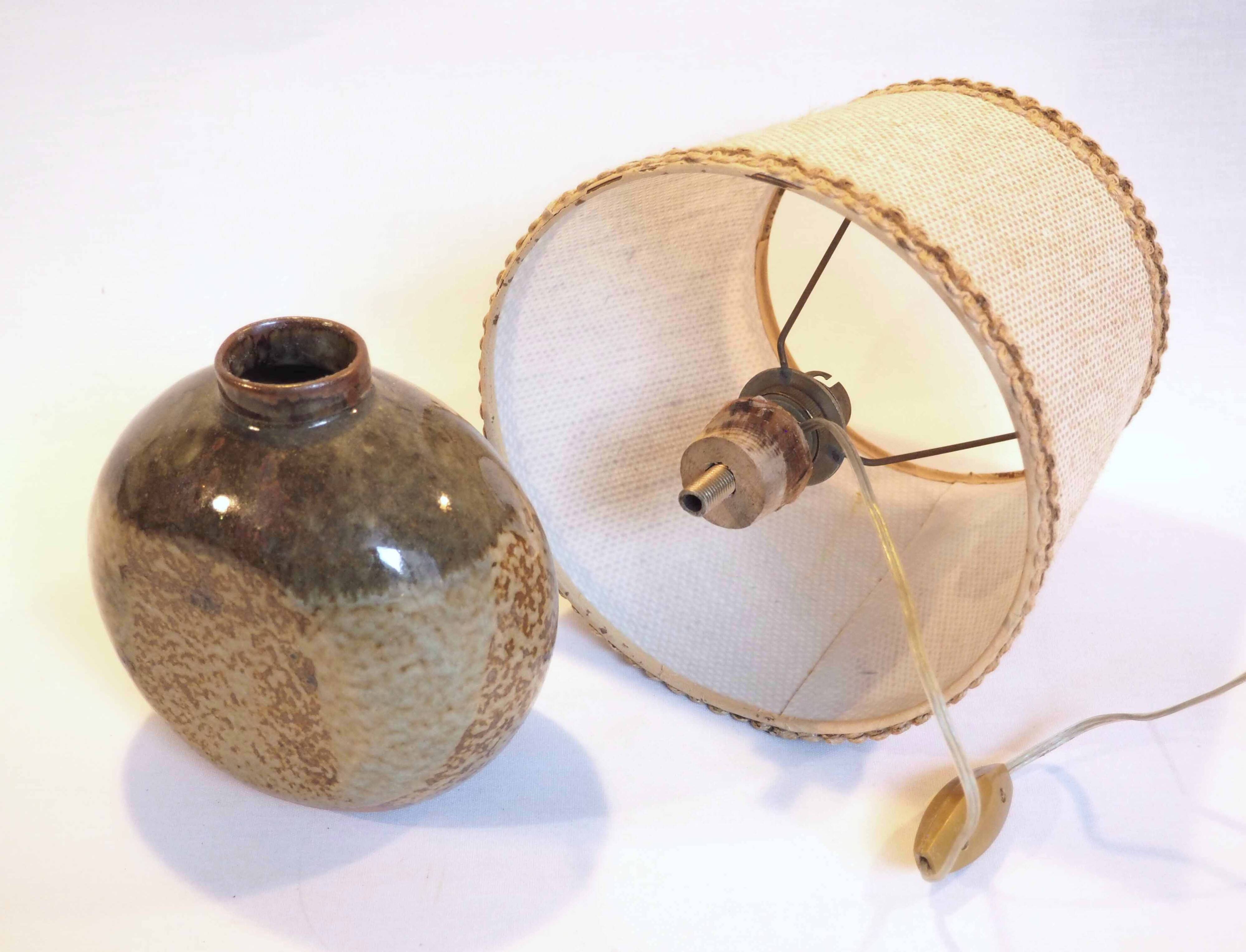 Flattened ball ceramic lamp