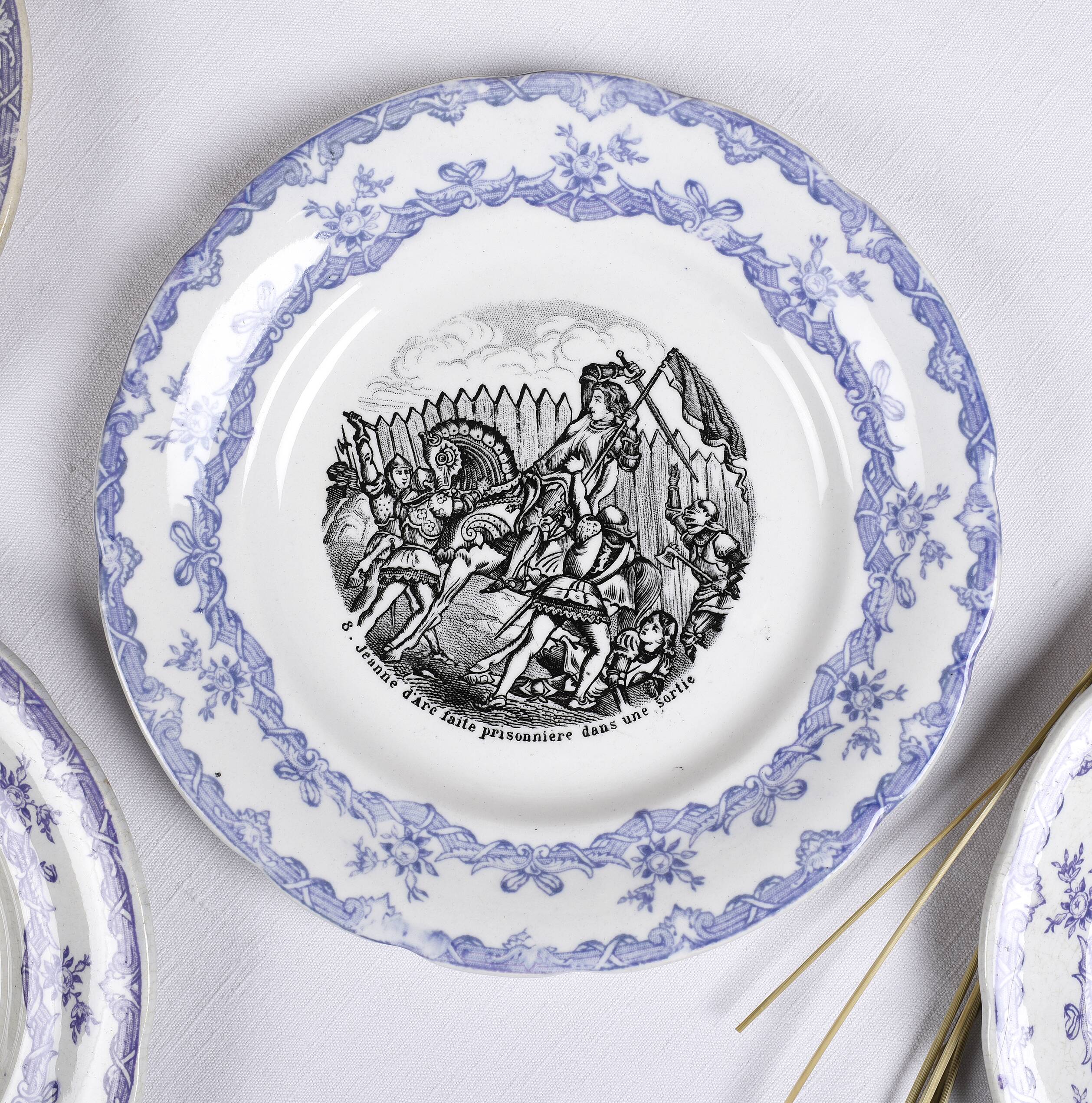 Collection of talking plates with Joan of Arc theme, in earthenware from the Choisy le Roi factory
