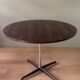 Round table in varnished rosewood