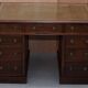 George III double-sided partner's desk in walnut circa 1780 with original handles.
