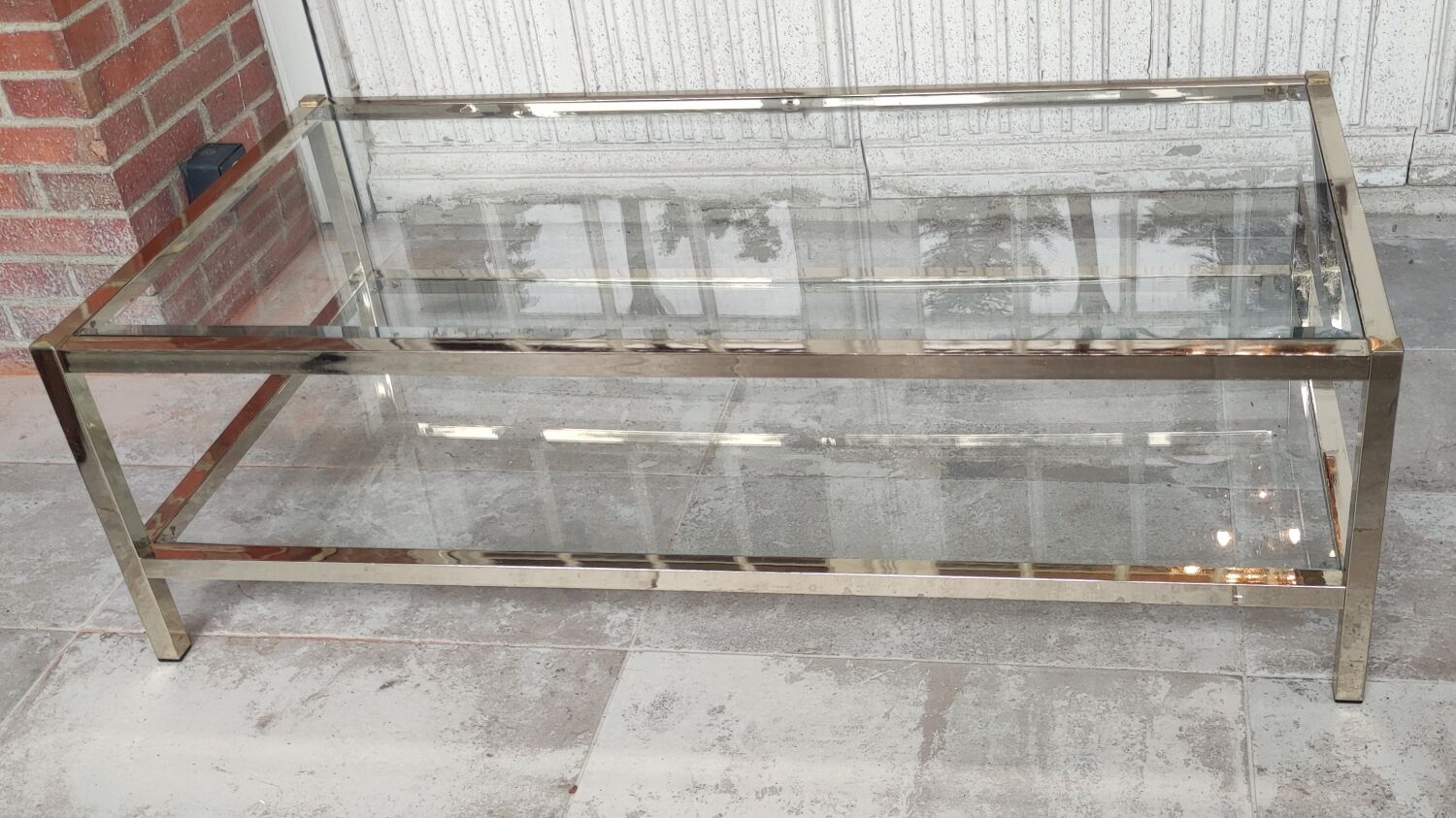 Table basse design métal doré et plateau verre biseauté