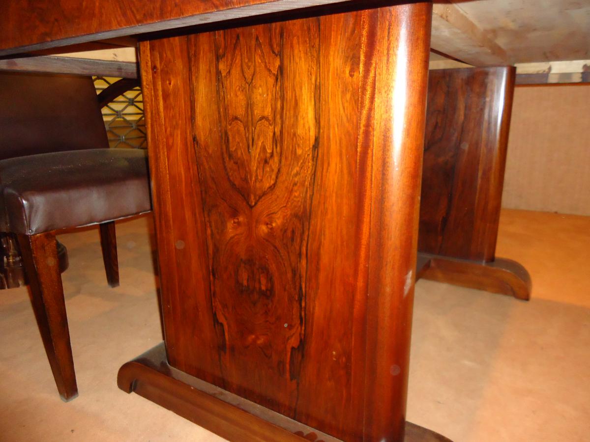 Modernist dining table in rosewood veneer.