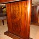 Modernist dining table in rosewood veneer.