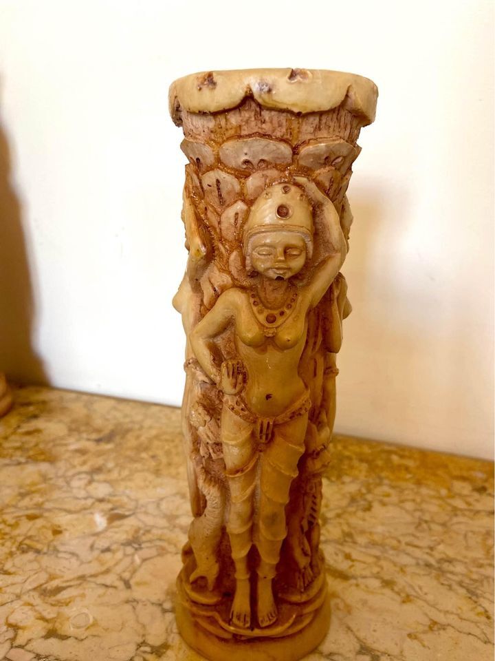 Two ancient Indonesian candlesticks.