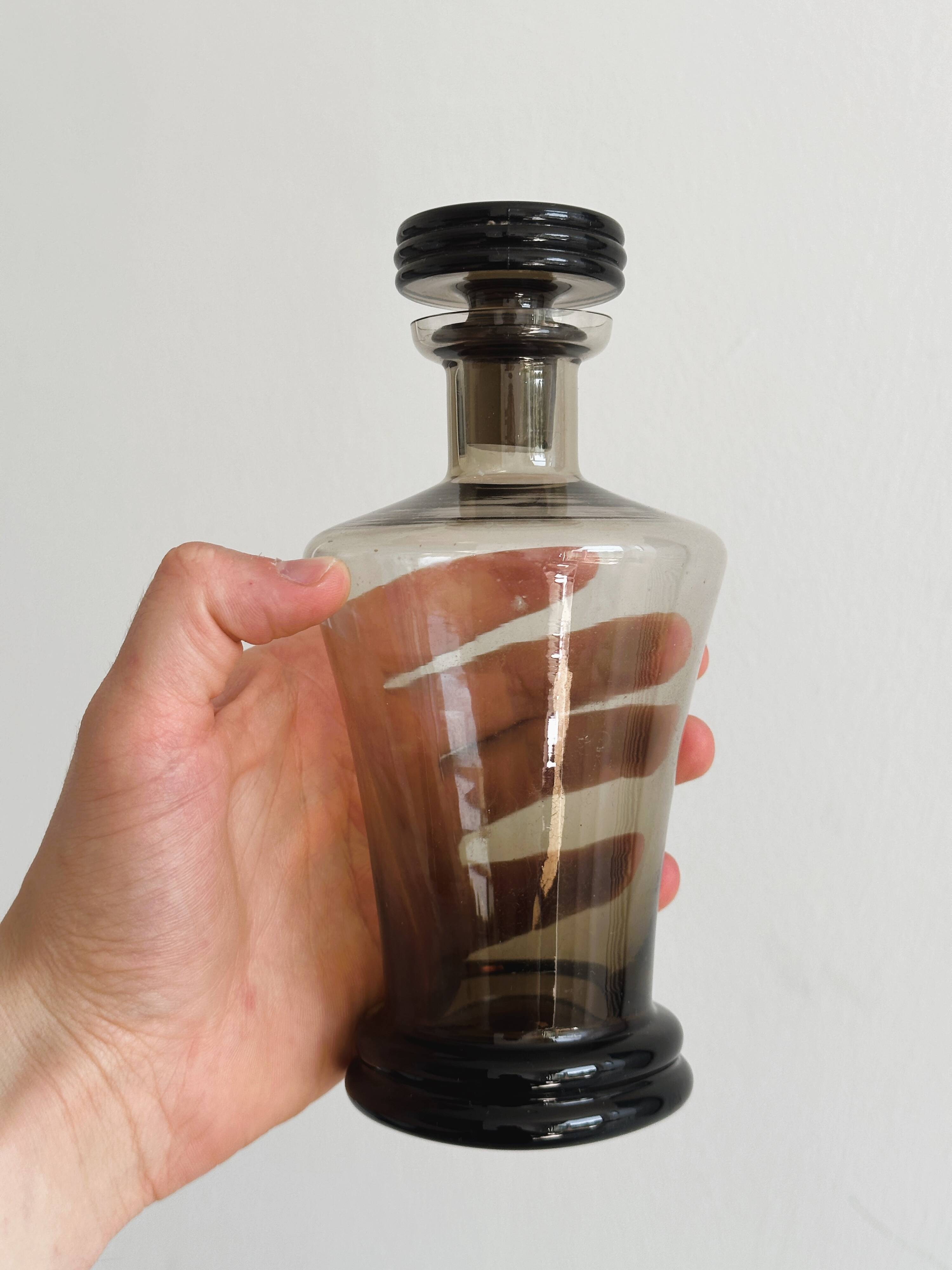 Smoked glass bottle, sculpted stopper