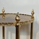 Round silver-plated brass table with triple eglomisé mirror tops from Maison Jansen.