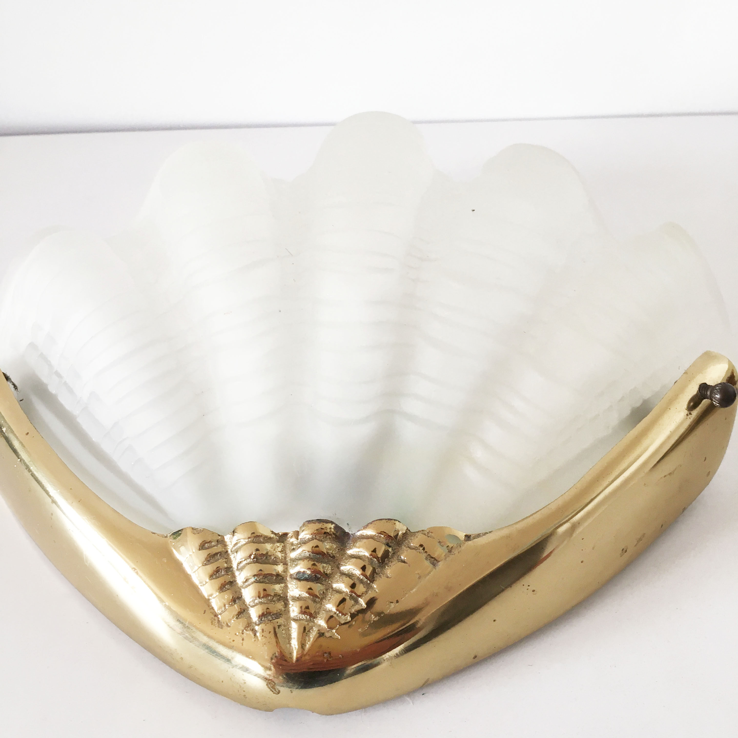 Pair of glass and gold metal shell sconces