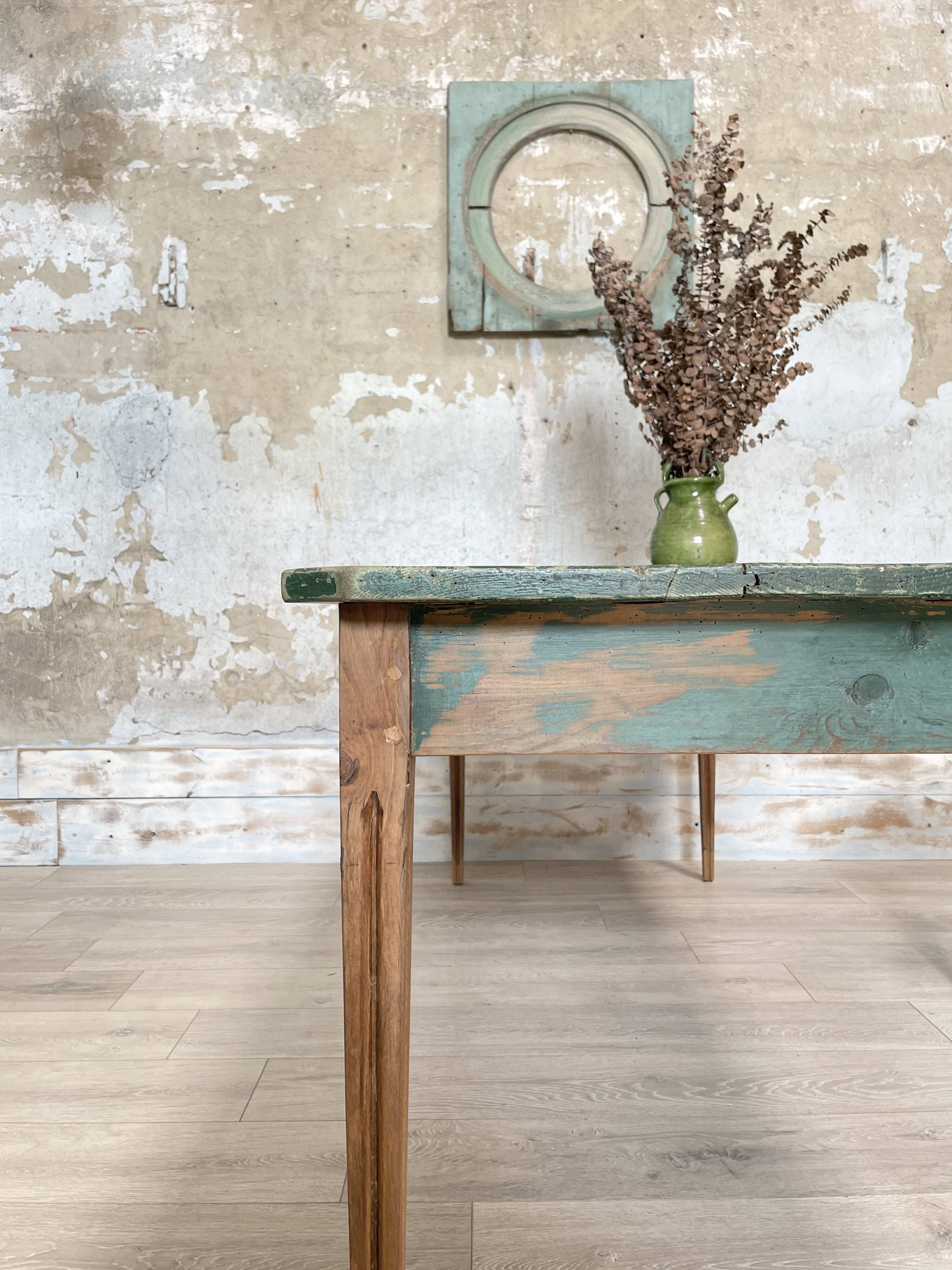 Vintage farm table with spindle legs.