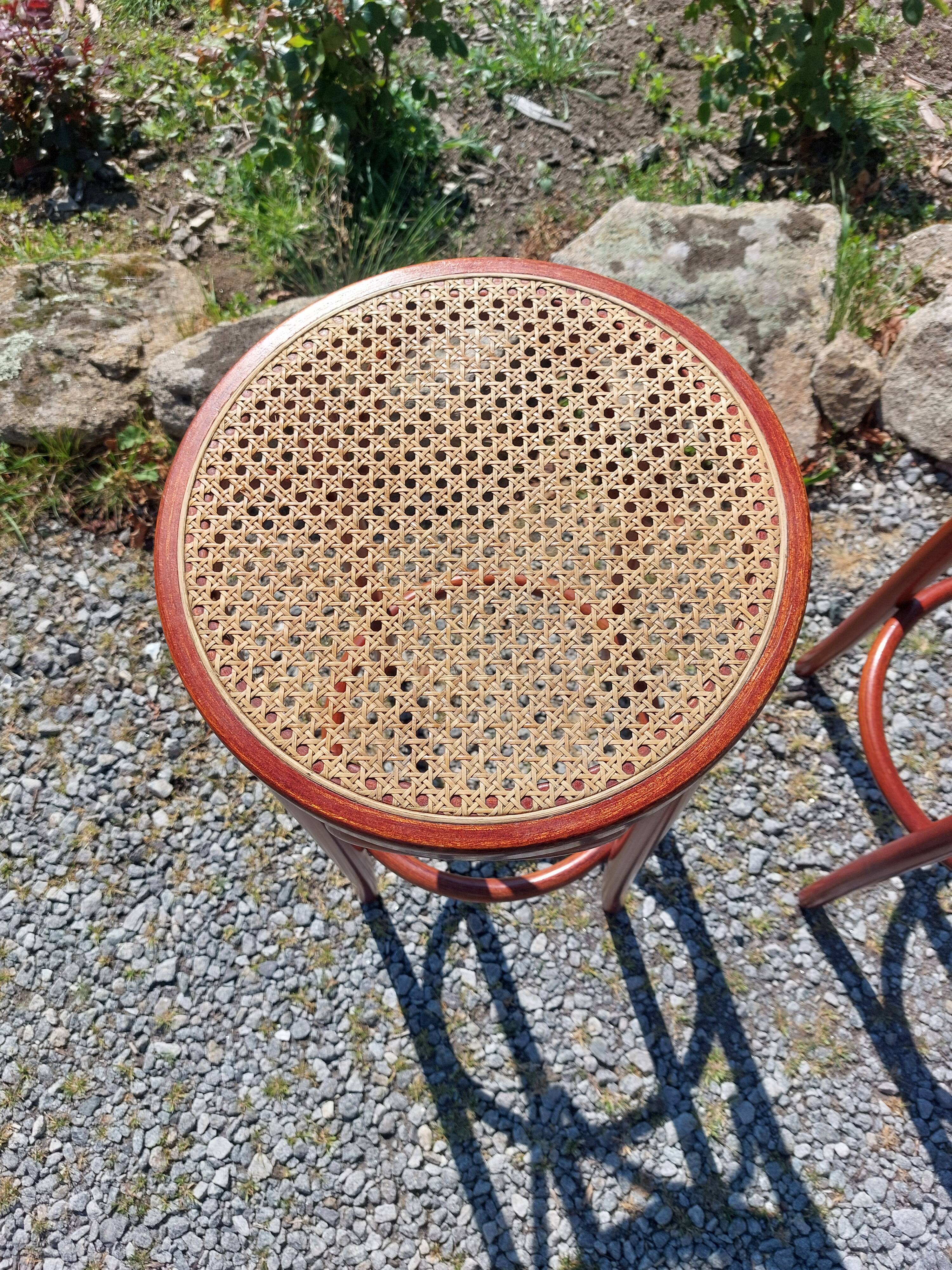 3 wooden and cane bar stools