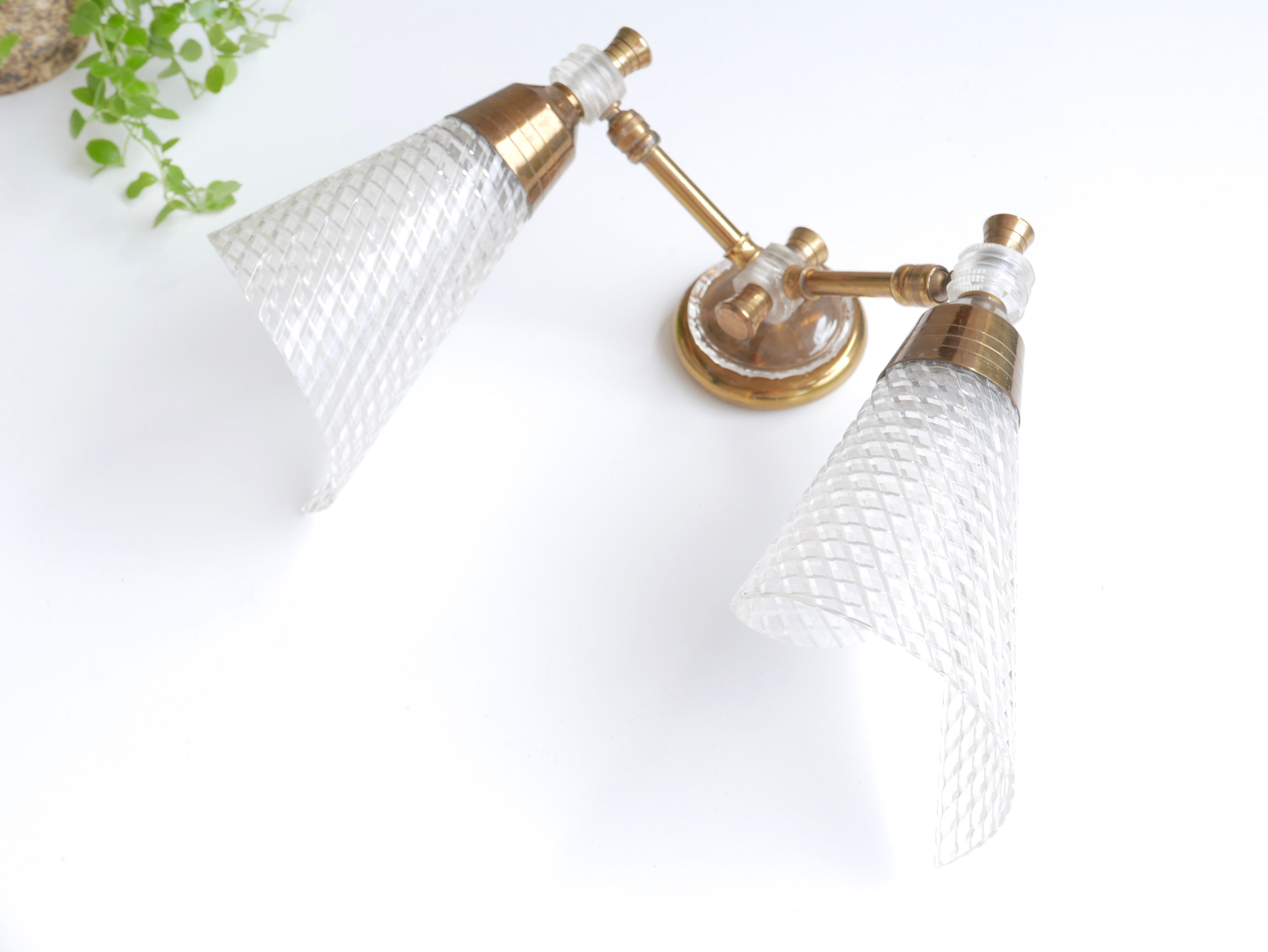 Pair of wall sconces in gold metal and plexiglass, 50 years