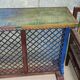 Colorful old standing eat with cast iron grill