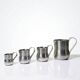 Set of 4 vintage bar measures in brushed stainless steel from the 60s-70s.