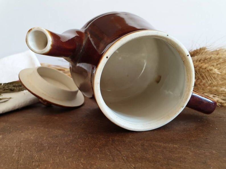 Vintage tea maker in old-fashioned country house-style earthenware