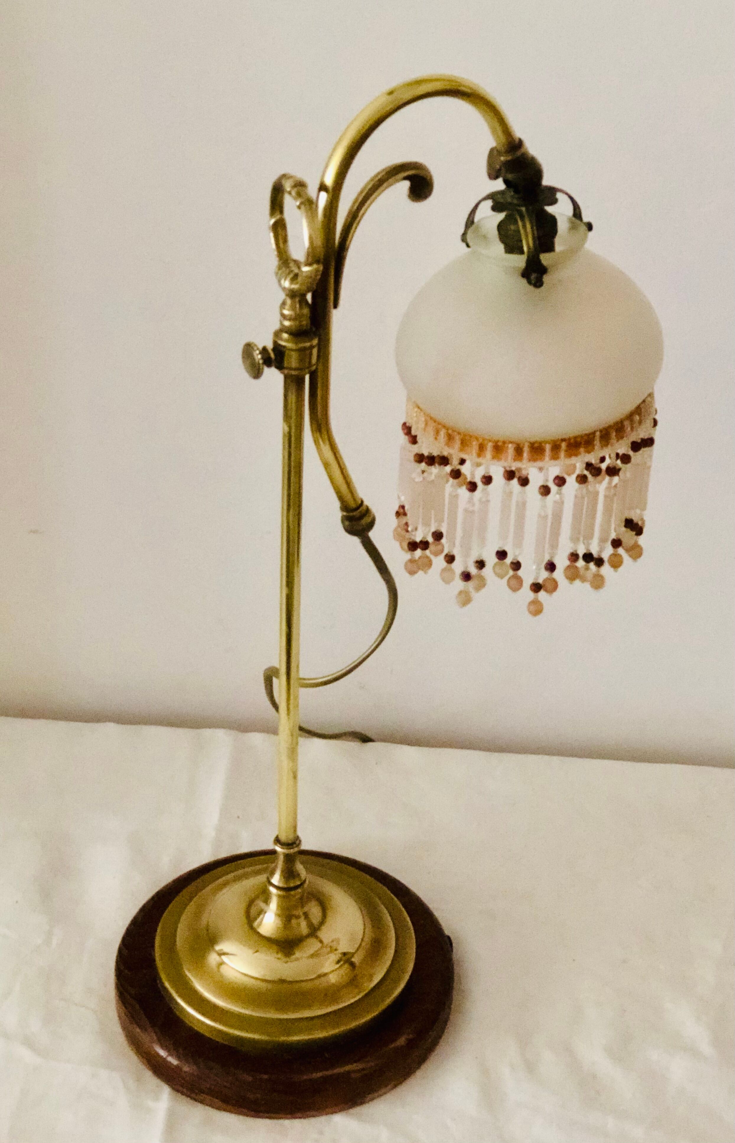 Old lamp adjustable on foot tulip golden brass.