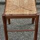 Paire de tabourets années 50 en bois et assise paillée