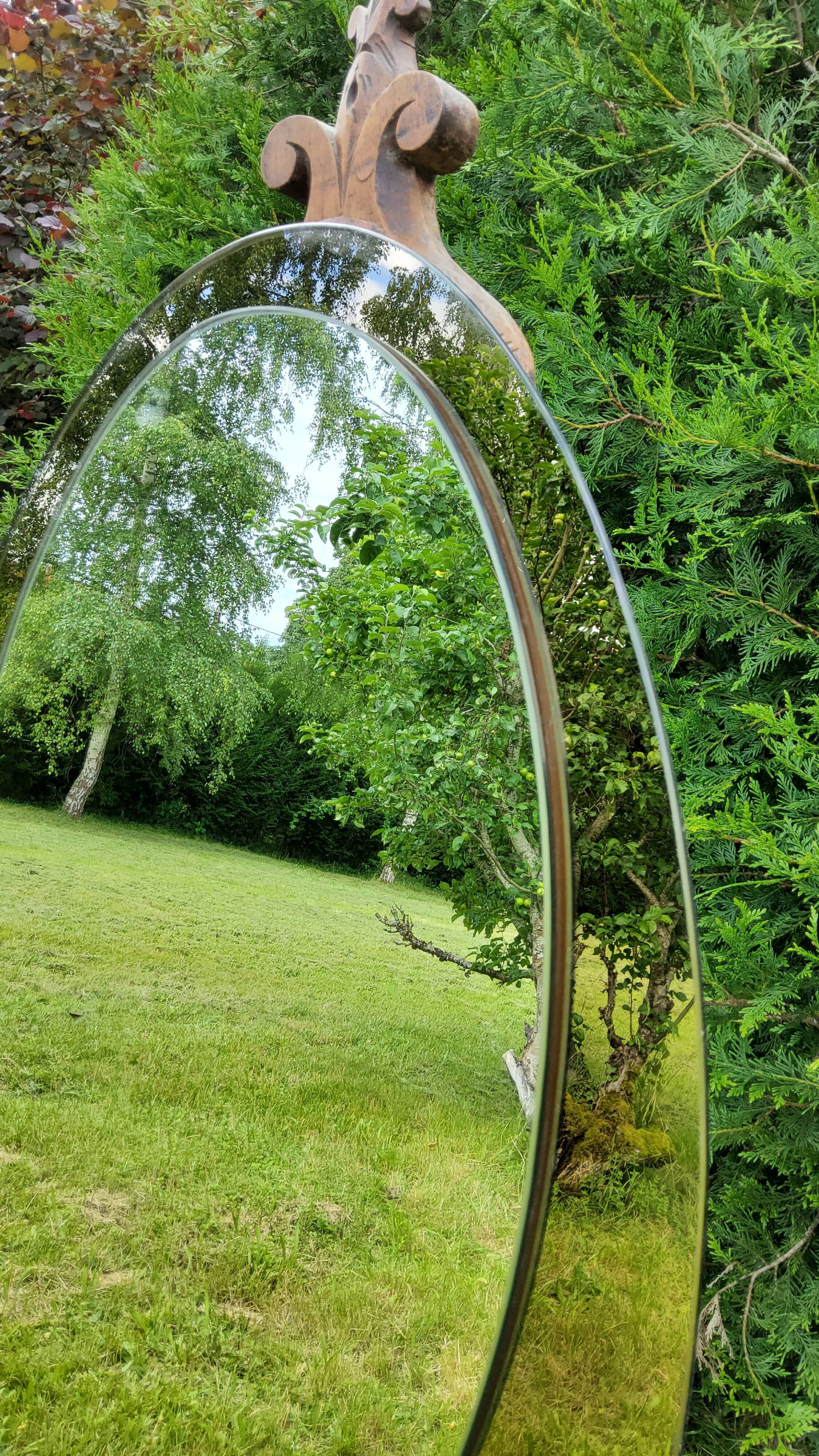 Oval Italian mirror of the 70s two complexions