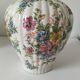 Antique vase with floral decoration in enamelled earthenware – timeless charm