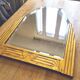 Antique Art Deco mercury mirror, in carved wood with gold leaf.