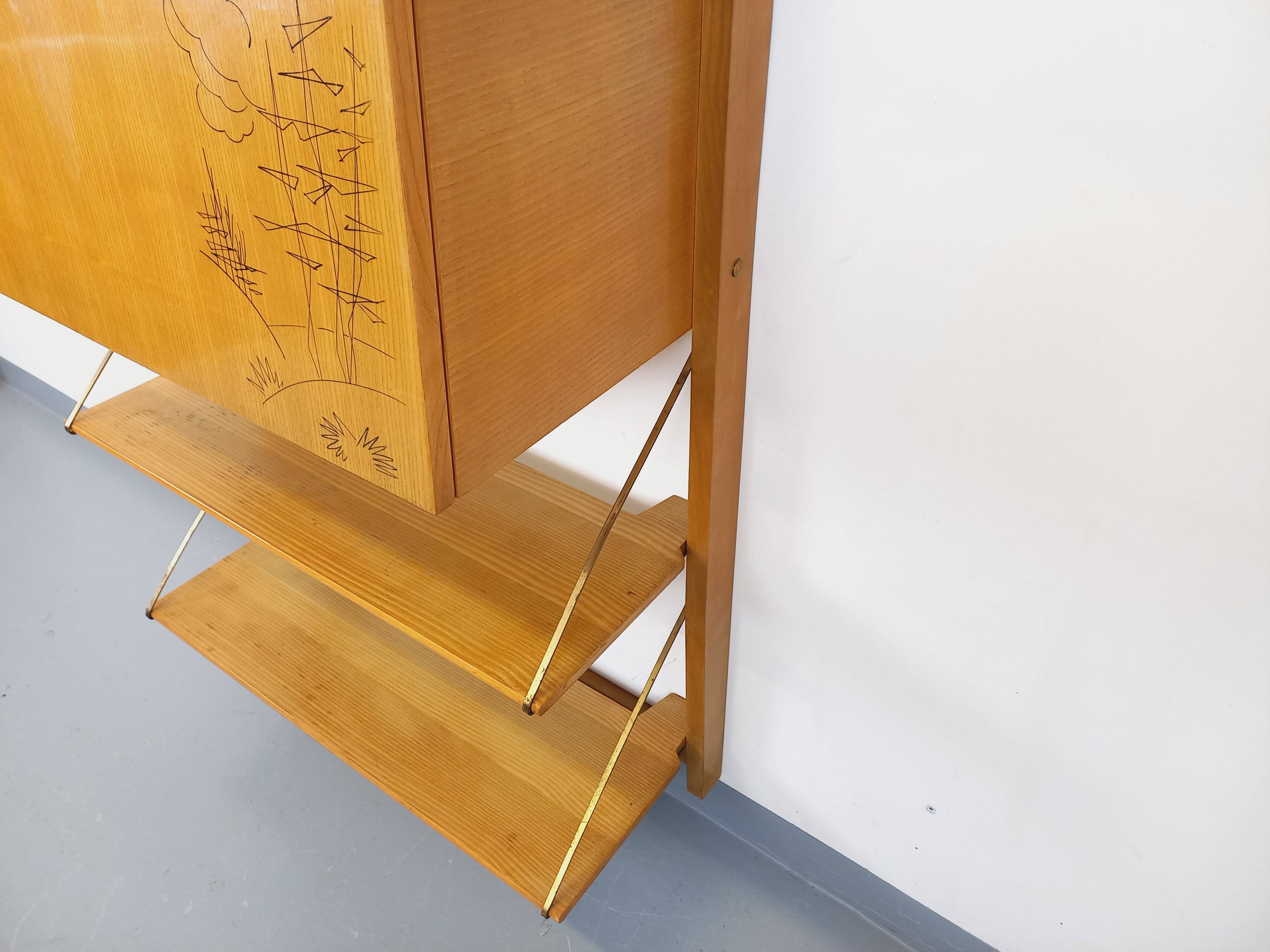 Wall shelf library with vintage light wood secretary bar