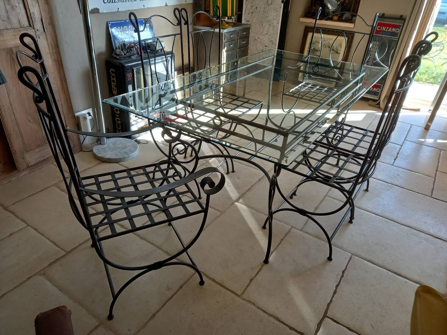 Glass table and wrought iron chairs