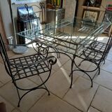 Glass table and wrought iron chairs