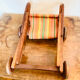 Vintage wooden folding doll's deckchair on wheels