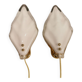 A set of Swedish wall lights in white glass shaped like a seashell. 1950-1960s