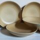 Five vintage natural stoneware soup plates
