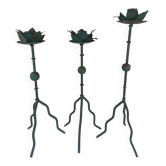 Sculptural candle holder trio