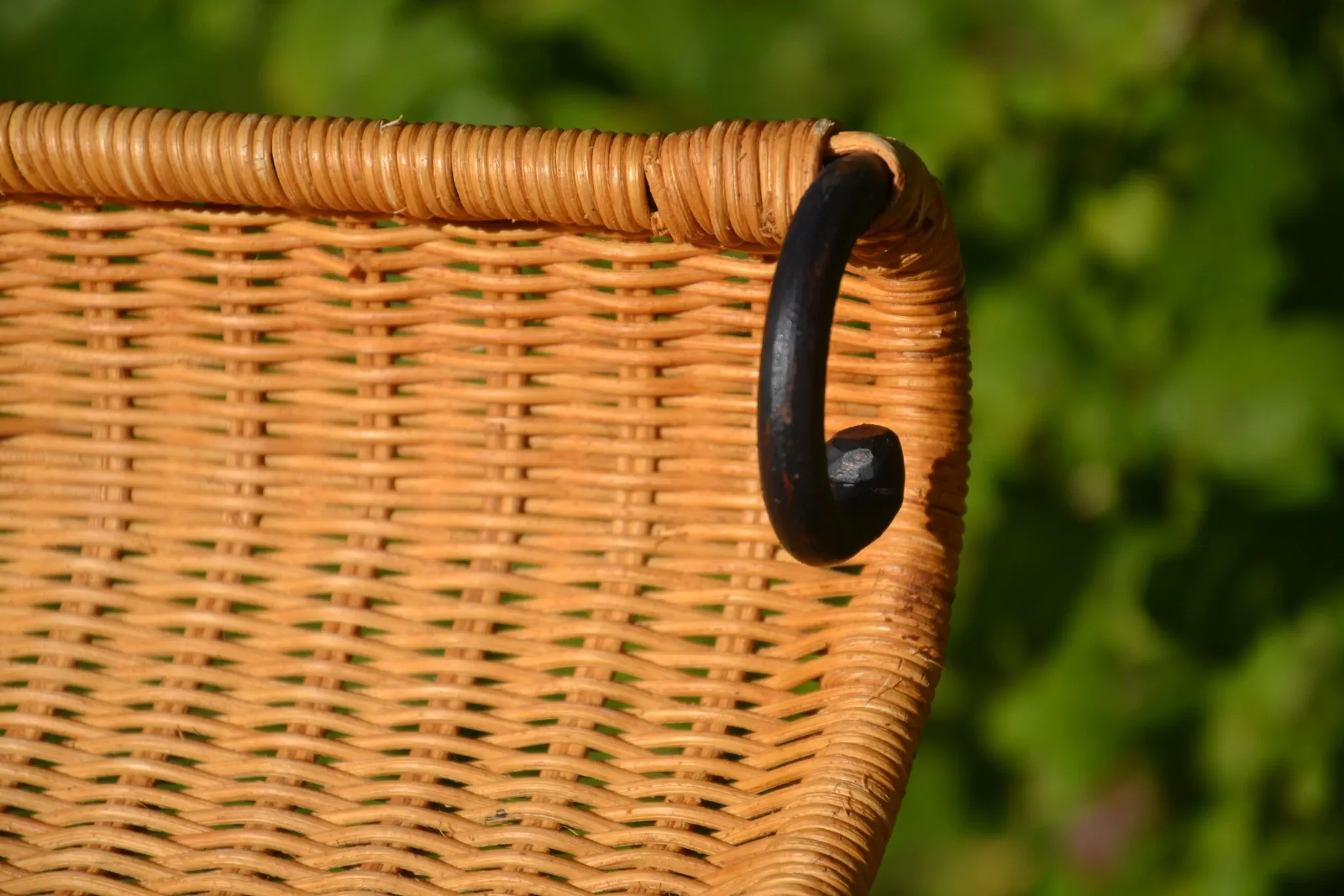 Wrought iron and rattan magazine/newspaper rack