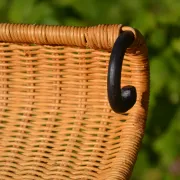 Wrought iron and rattan magazine/newspaper rack