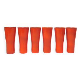 Six orange ceramic cups from the 1960s