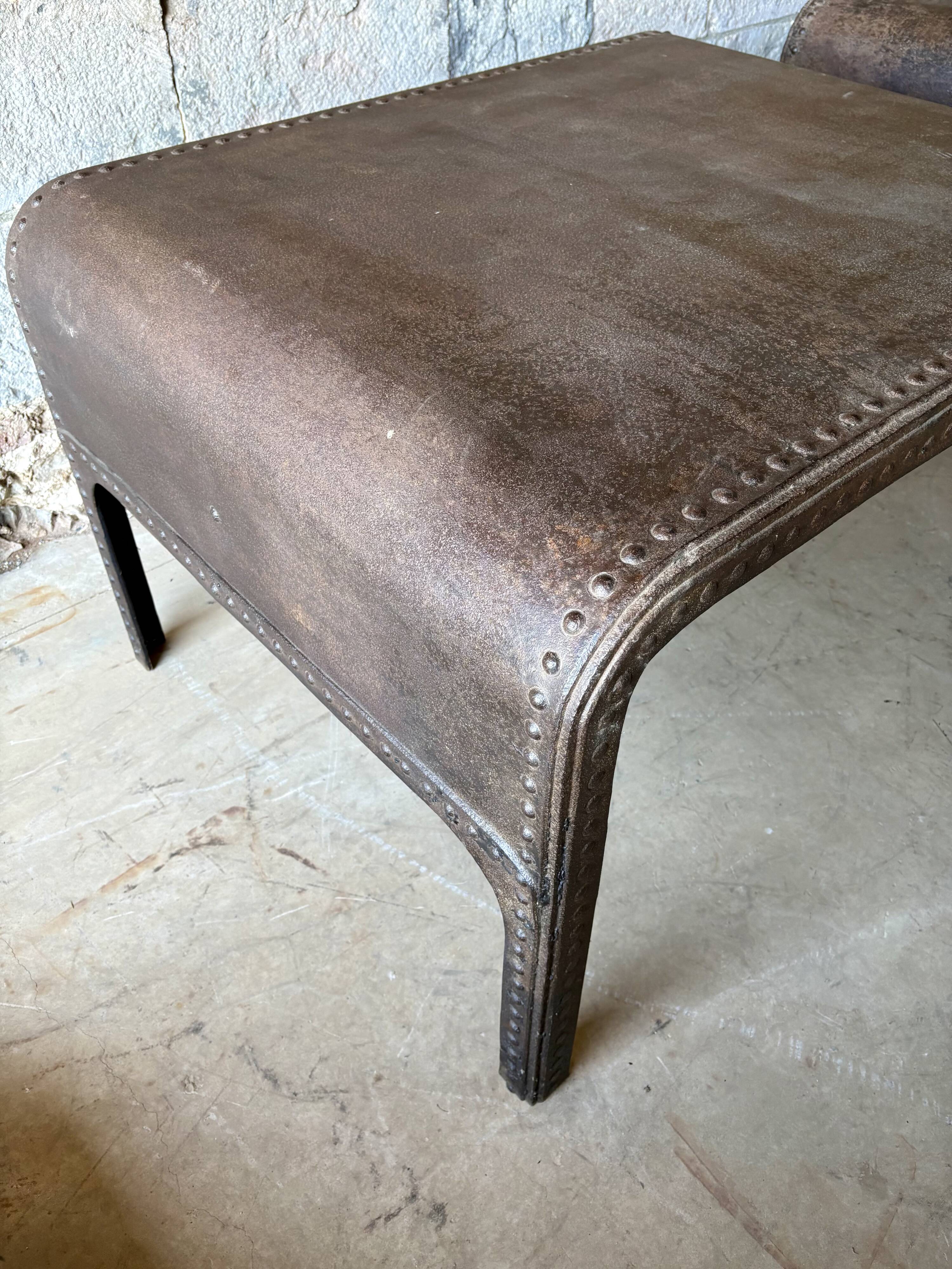 Pair of large riveted metal industrial tables