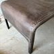 Pair of large riveted metal industrial tables