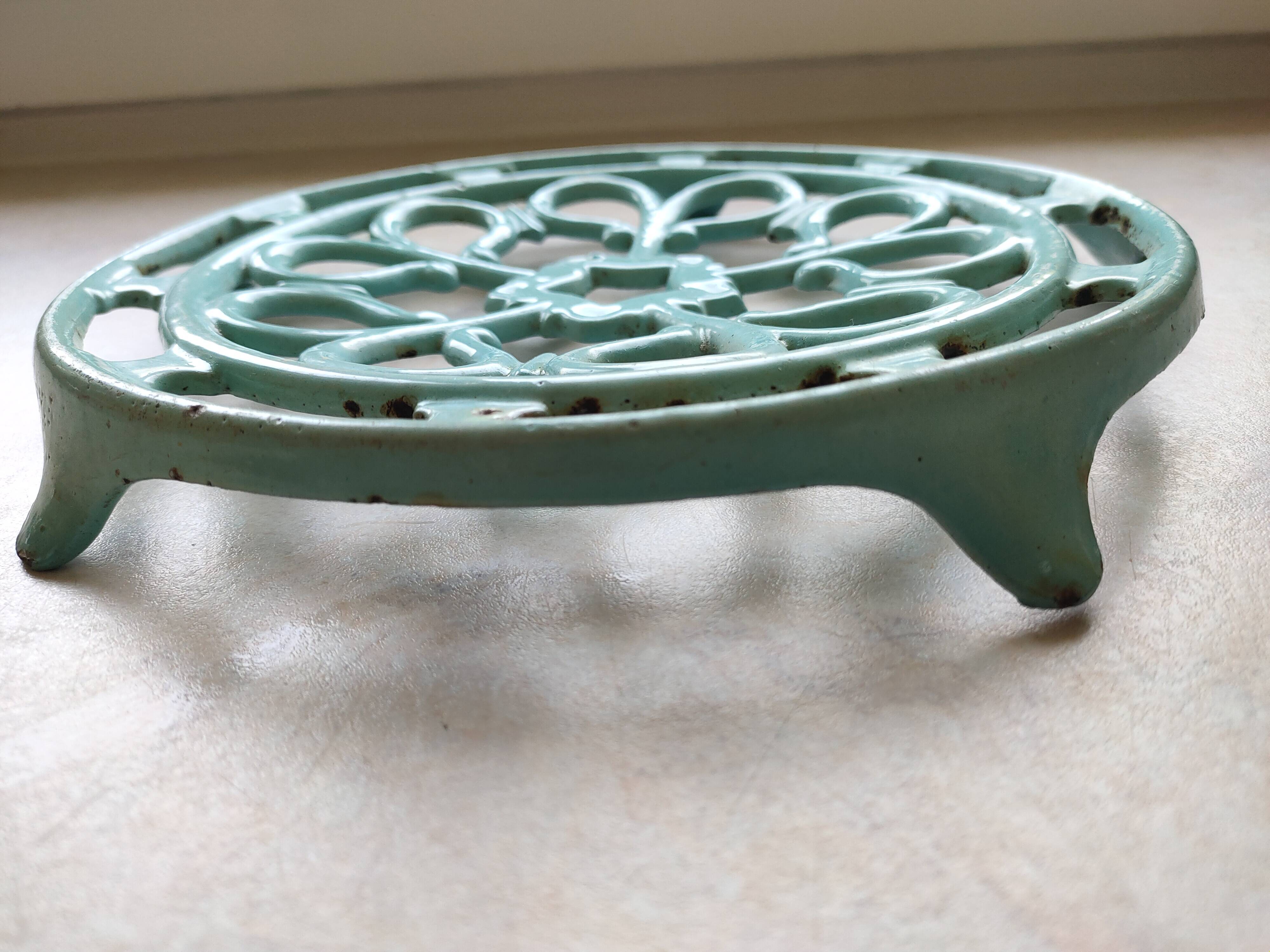 Water green enamelled trivet.