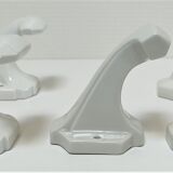 Five art deco white porcelain hooks
