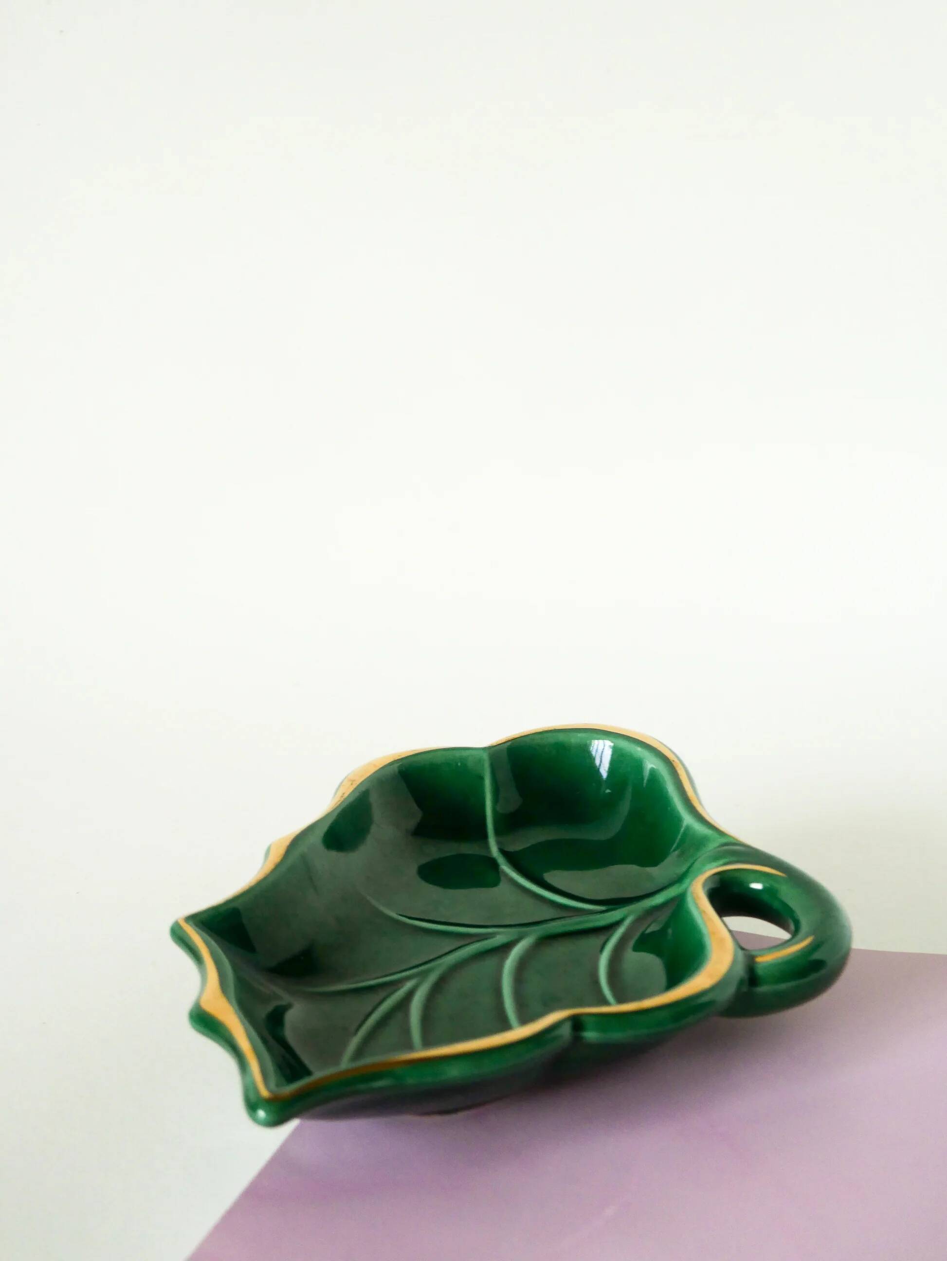 Leaf-shaped earthenware catchall, green and gold, 1970.