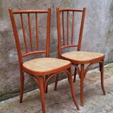 Pair of wooden and cane bistro chairs