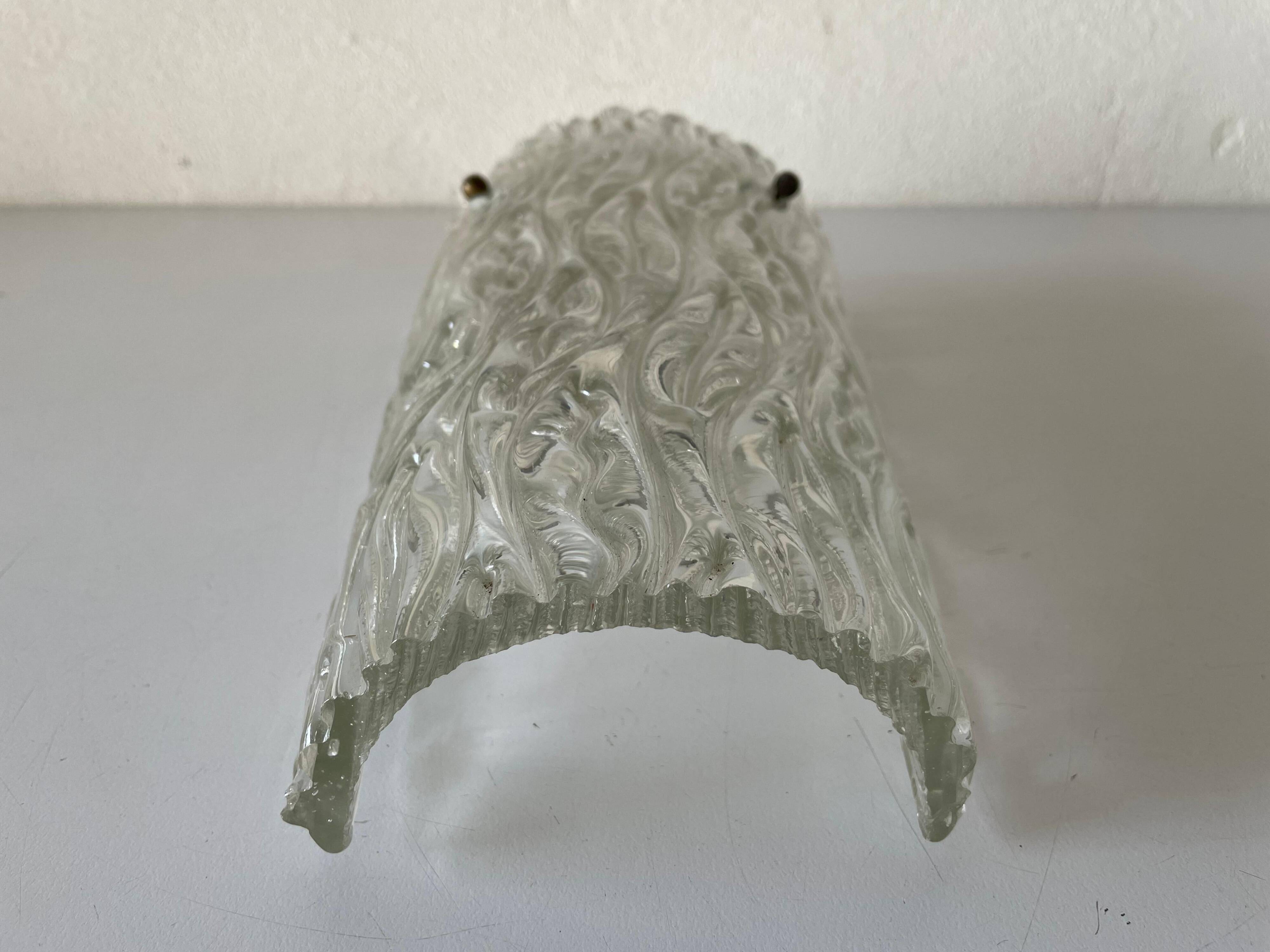 Simple arch-shaped wall light in textured glass, 1950s, Germany.