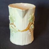Old pitcher in slip 1900 ivy or holly decoration