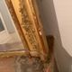 Nineteenth century mirror in wood and stucco gilded with rich gold leaf ornamentation, 101x127 cm