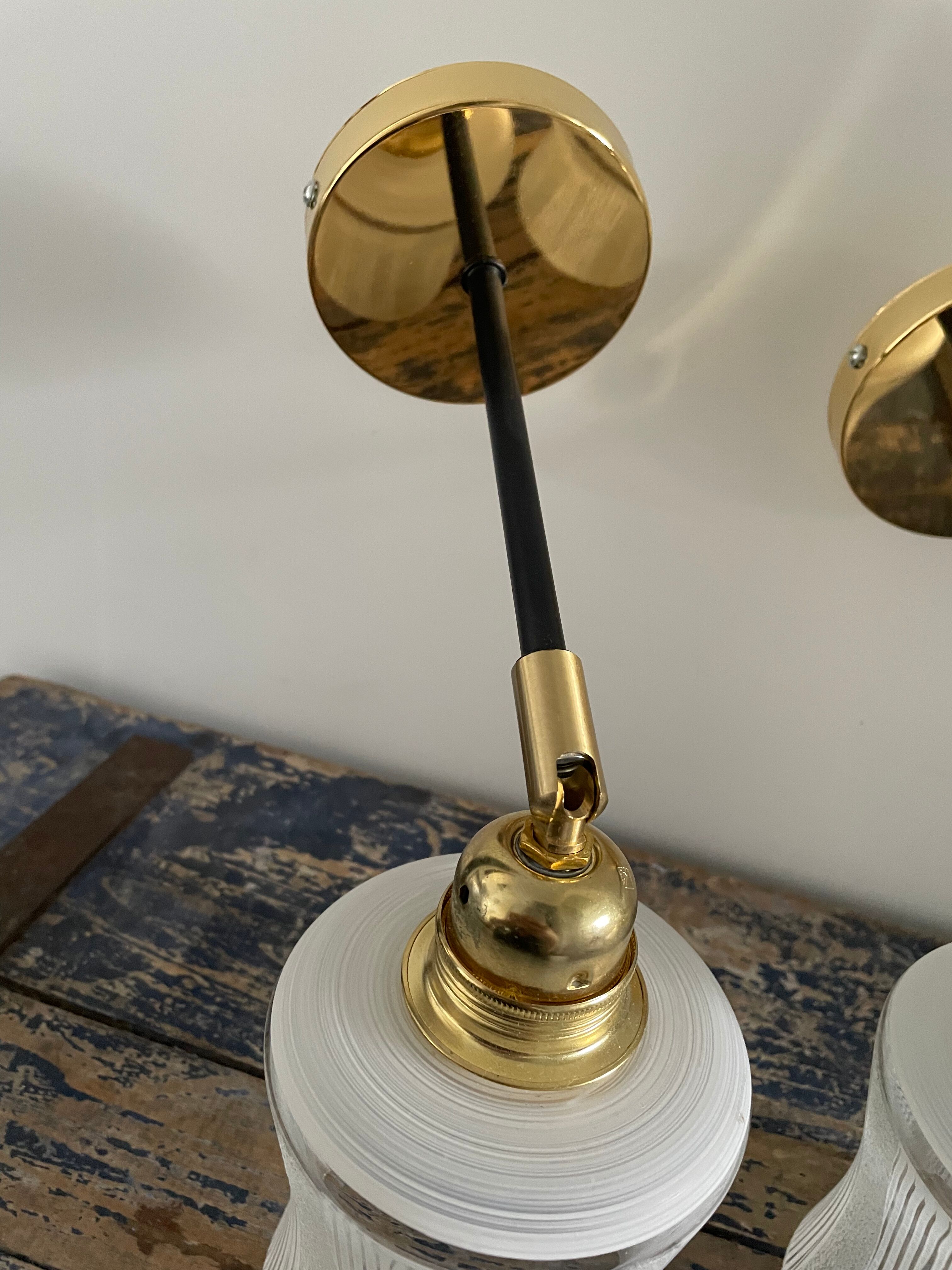 Pair of vintage wall lamps in electrified glass to nine