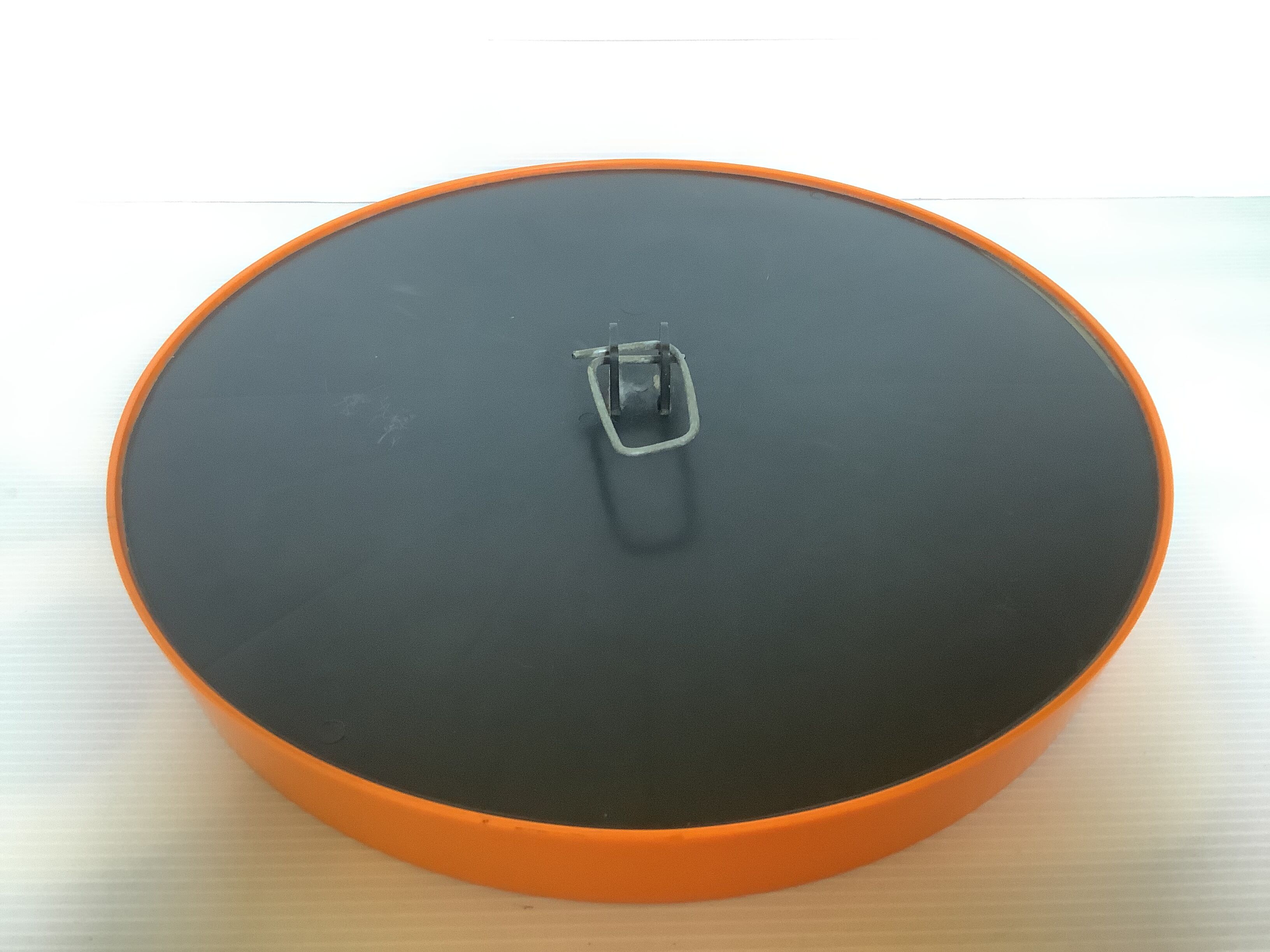 Old vintage orange round mirror