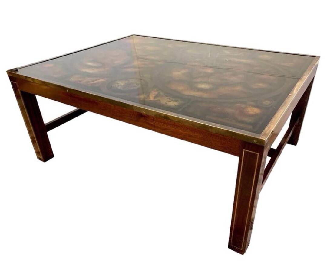 Coffee table in exotic wood, brass trim and planisphere under glass.