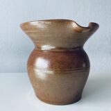 Old pitcher in glazed terracotta