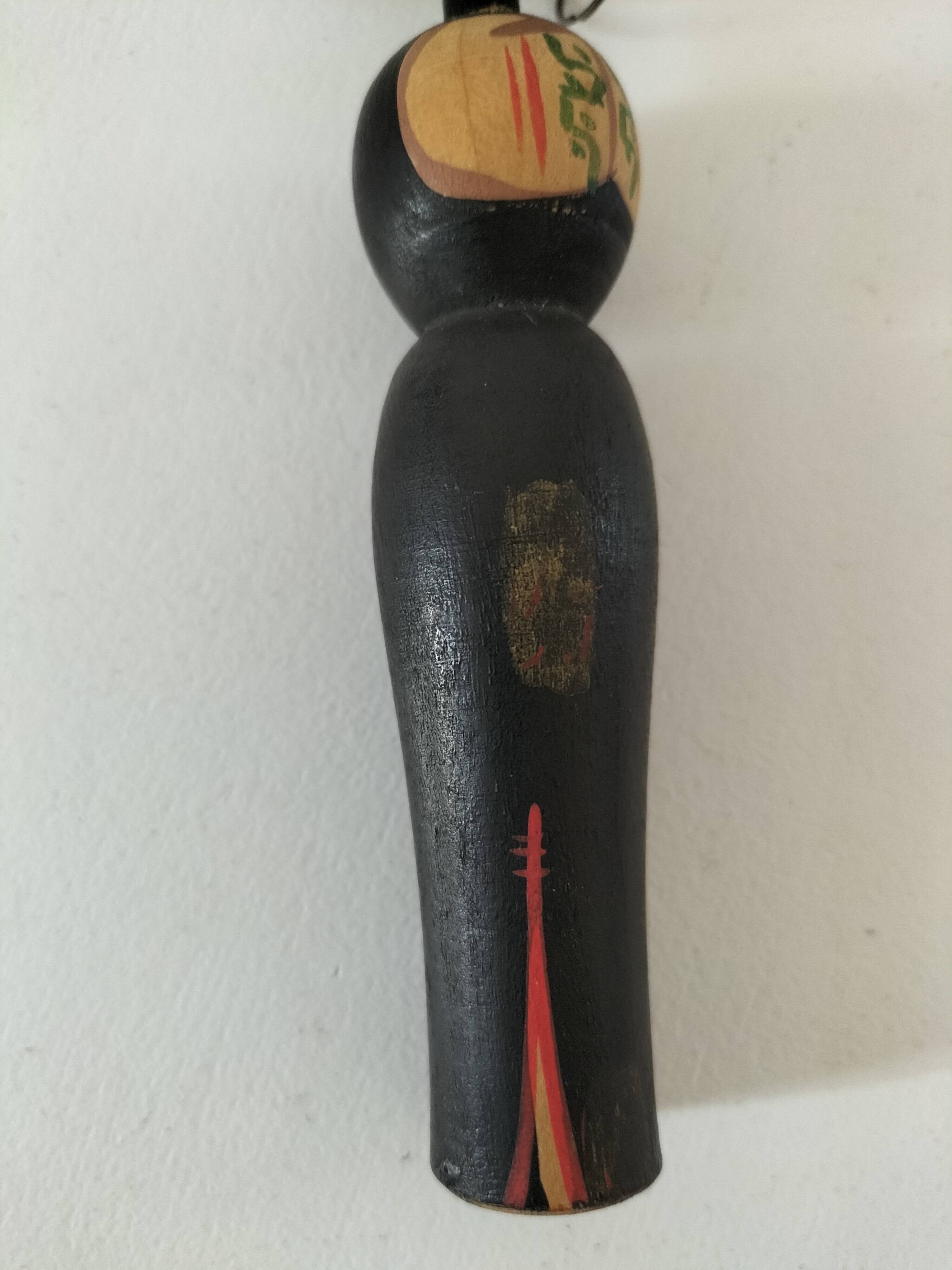 Pair of Japanese Kokeshi dolls - 1950s-1970s
