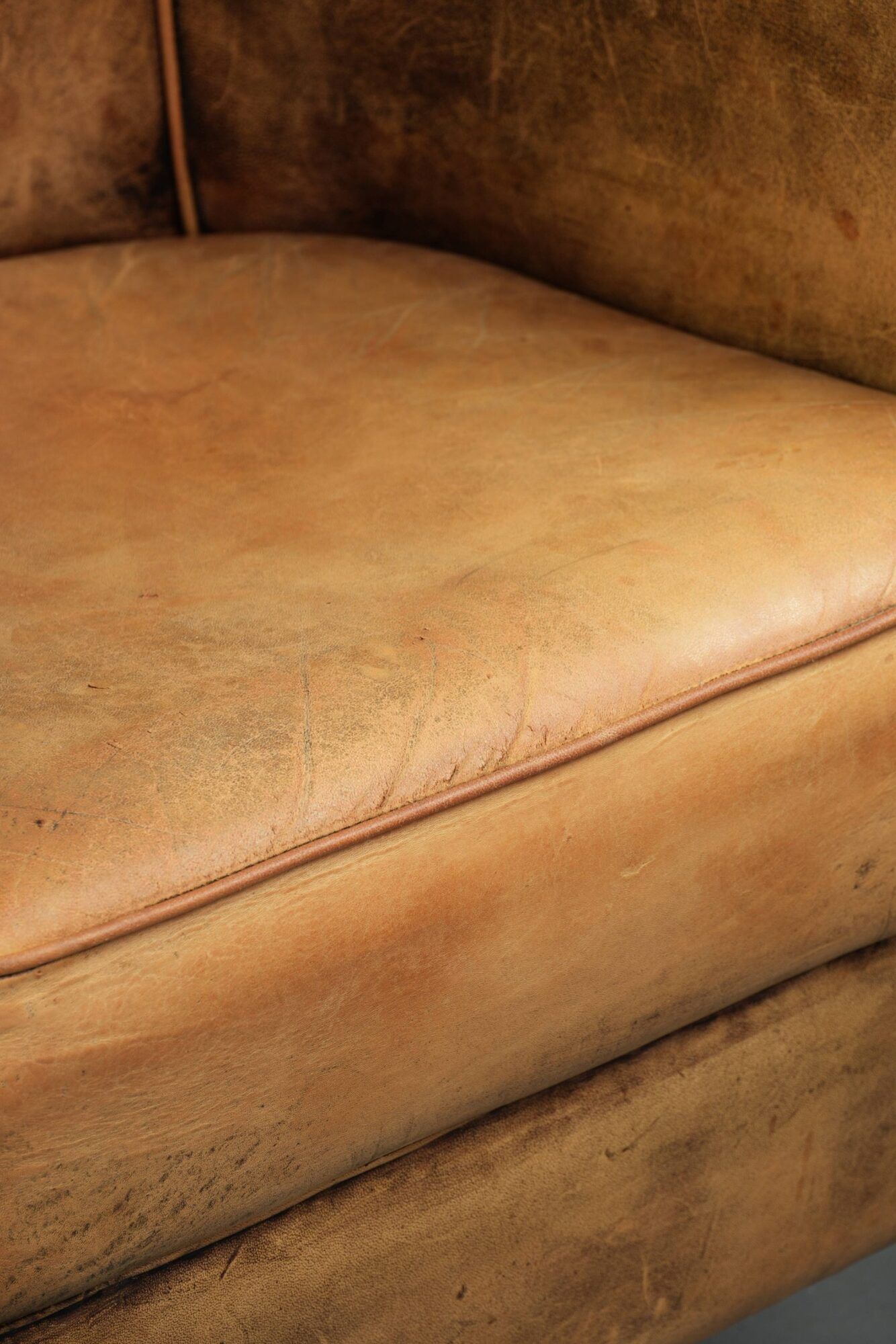 Vintage sheepskin club armchair in a light cognac colour