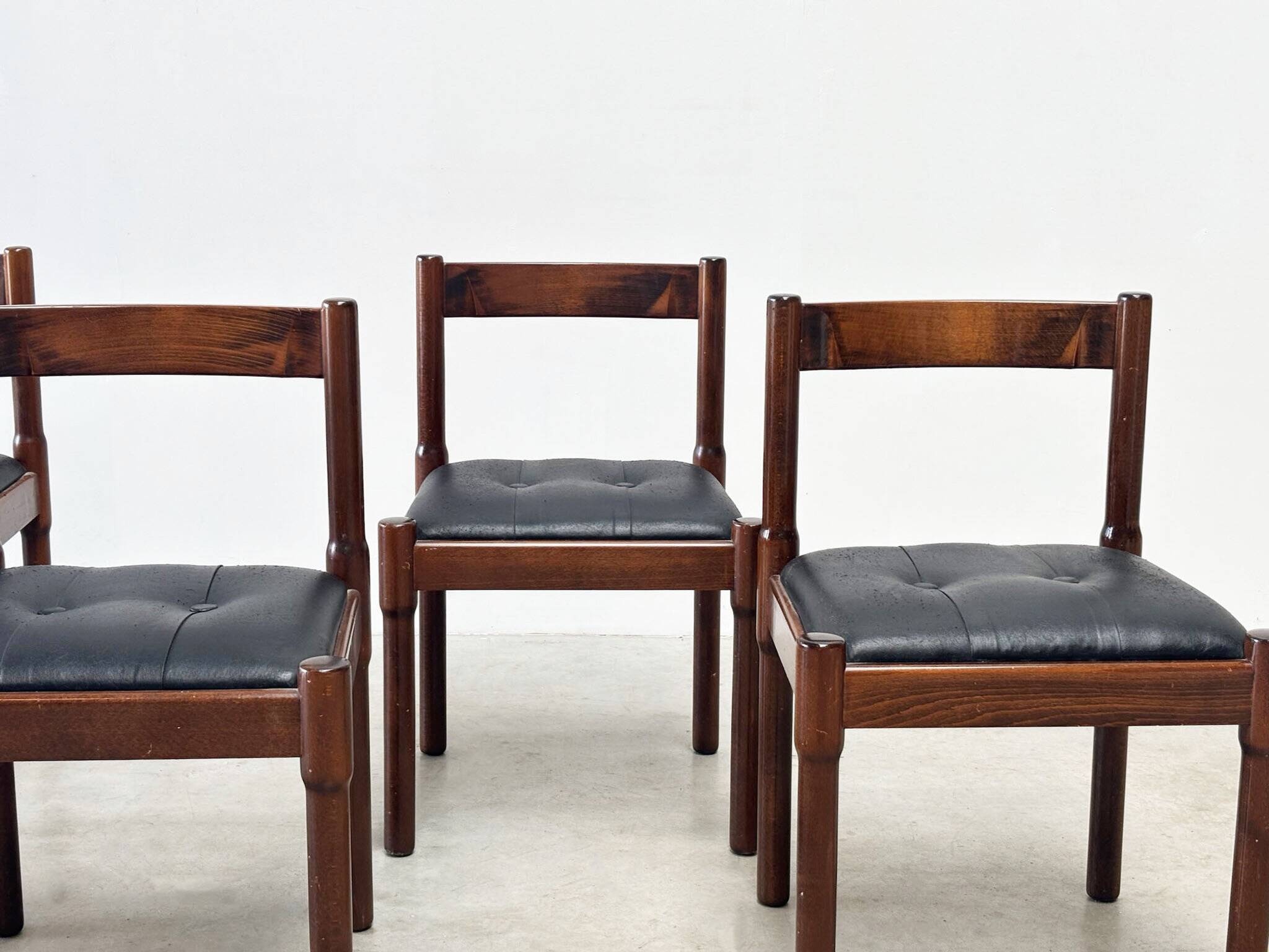 Set of six leather "Carimate" dining chairs by Vico Magistretti for Cassina